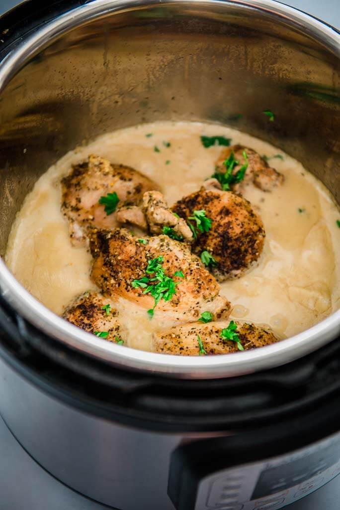 instant pot full of chicken thighs with lemon sauce
