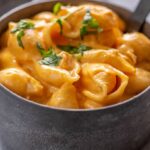 buffalo chicken Mac and cheese with shell pasta in gray metal bowl