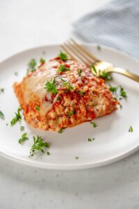 slow cooker cheese lasagna slice on white plate