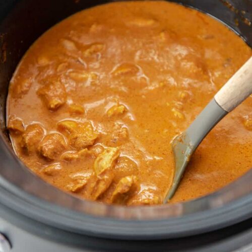 ladle in a slow cooker with butter chicken