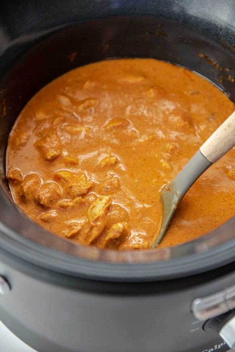 ladle in a slow cooker with butter chicken