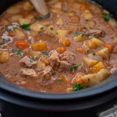 slow cooker filled with fall harvest pork stew