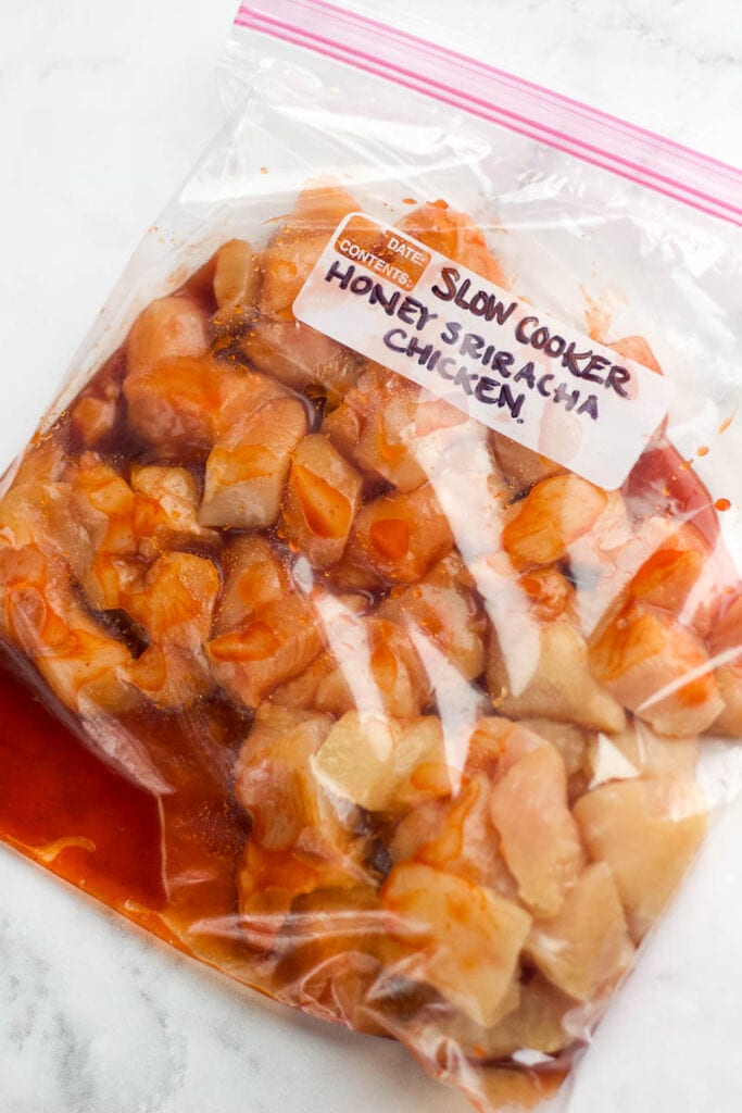 freezer bag with honey sriracha chicken for meal prep