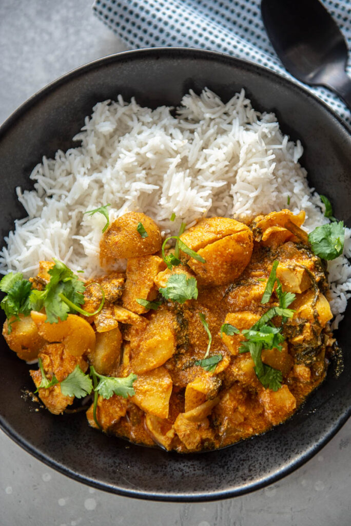coconut curry chicken with rice in a bowl