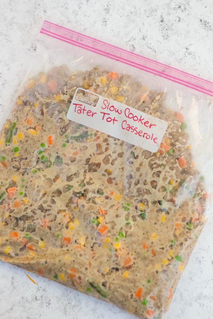 tater tot casserole mixture in a labeled freezer bag