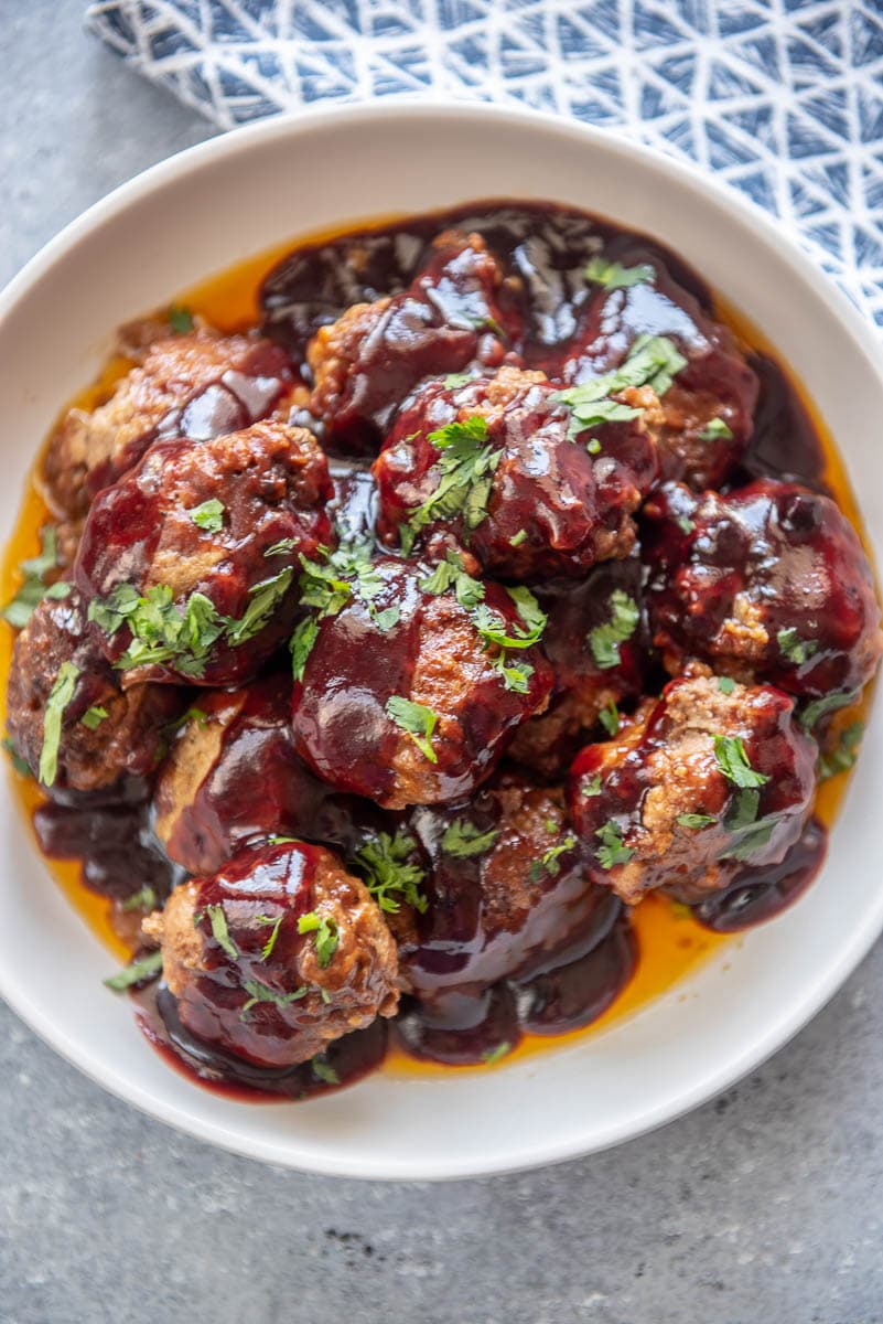 ingredients for meatballs in glass bowl