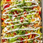 buffalo chicken nachos with ranch dressing drizzle
