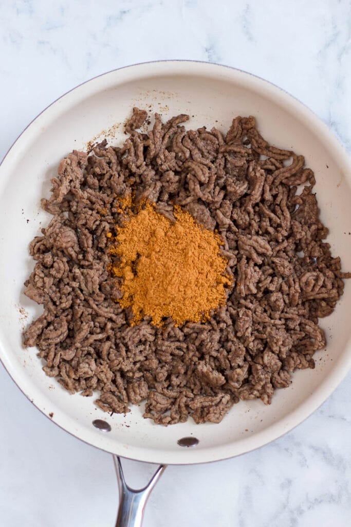 ground beef with taco seasoning in skillet