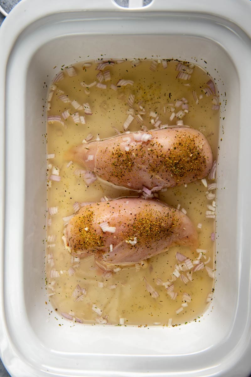 chicken and spices in slow cooker