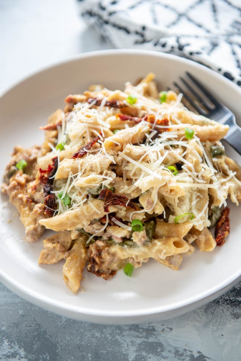 slow cooker sausage pasta bake on a plate with fork