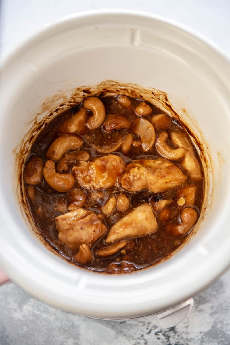 cooked cashew chicken in a slow cooker