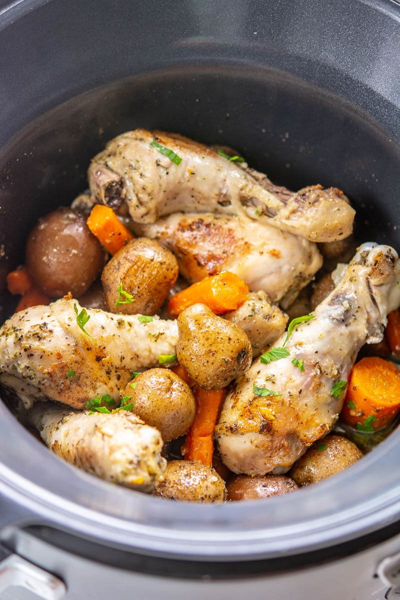 cooked chicken and potatoes in a slow cooker