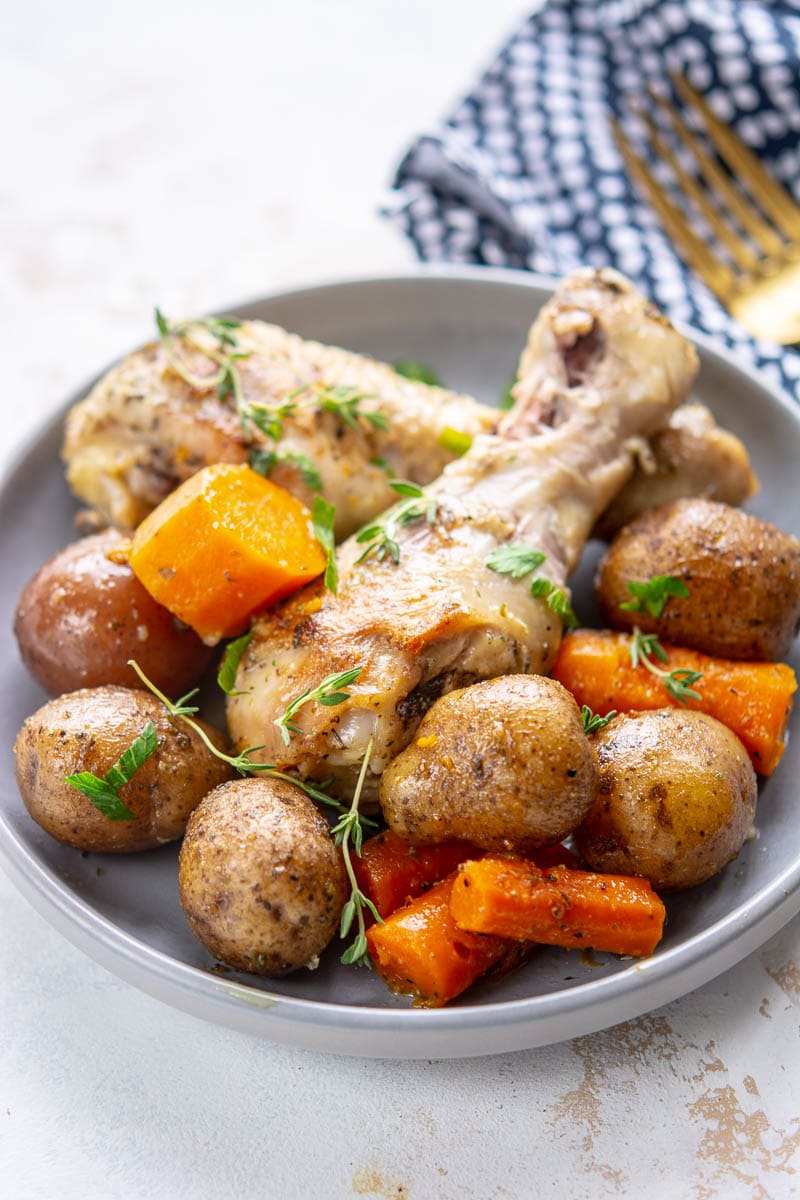 chicken and potatoes on a gray plate