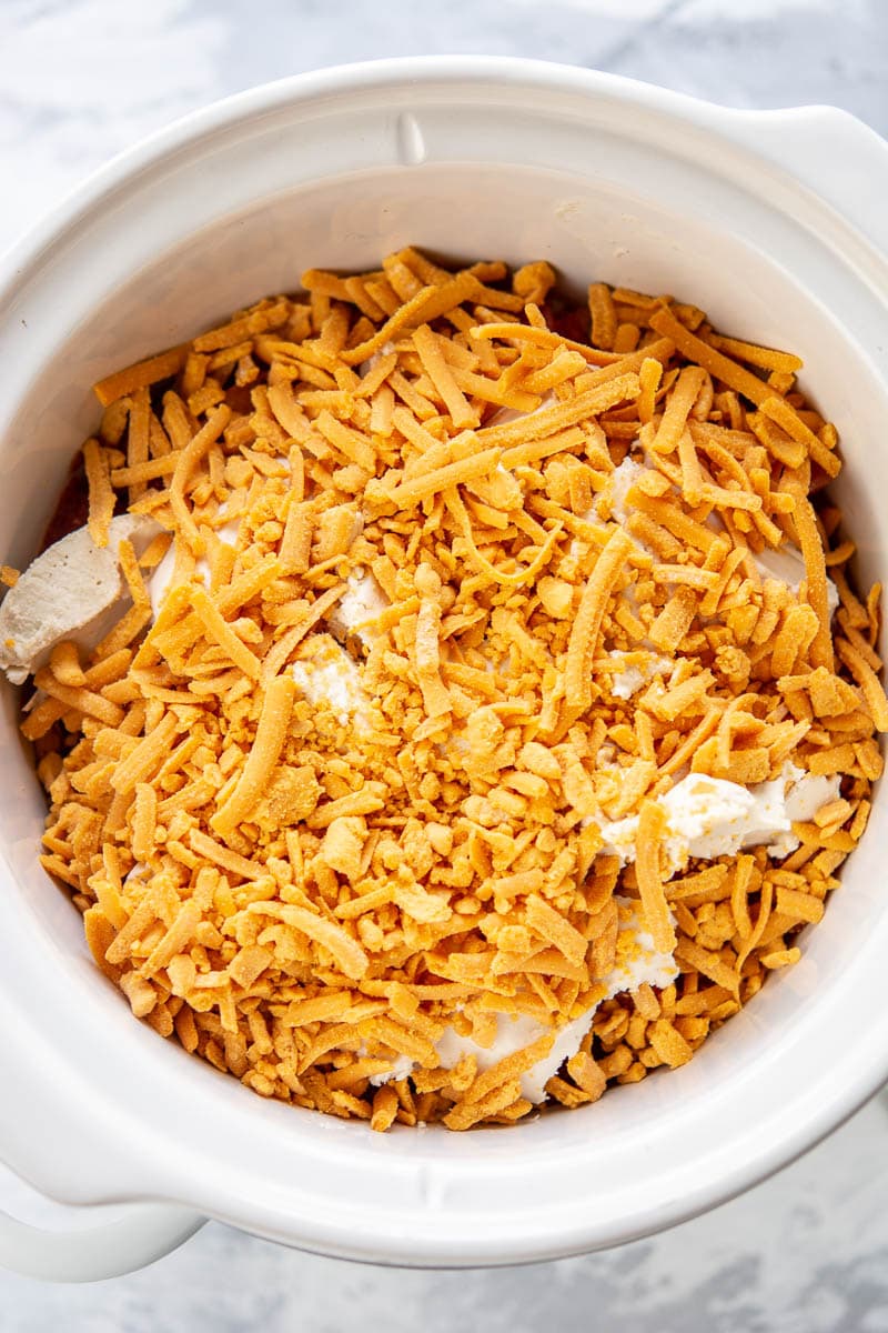 ingredients for chili cheese dip in a slow cooker