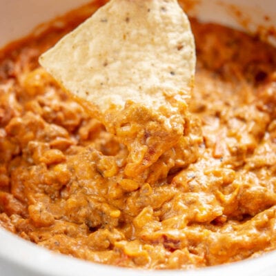 chili cheese dip with a tortilla chip