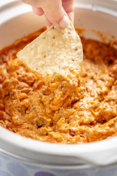 chili cheese dip with a tortilla chip