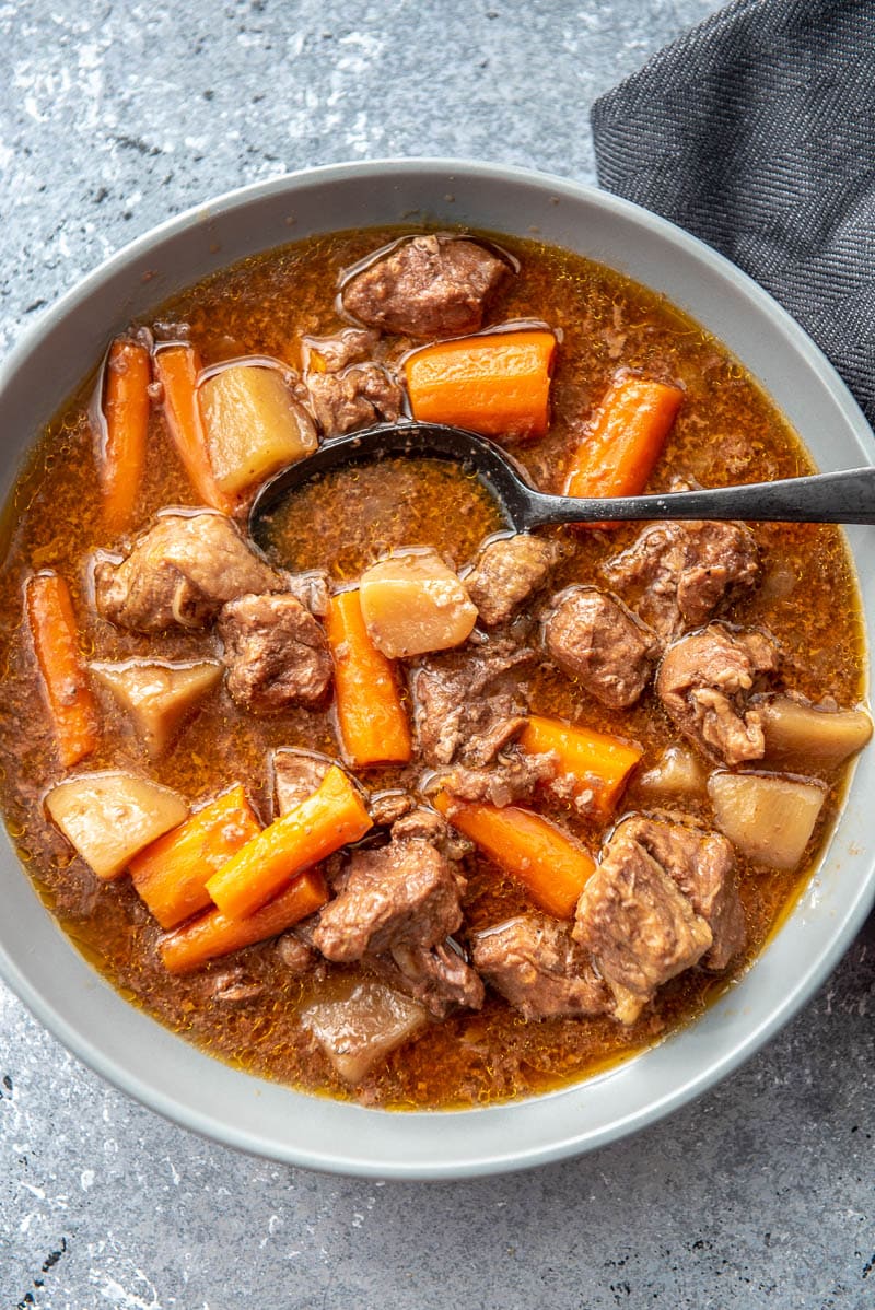 beef stew in bowl with spoon