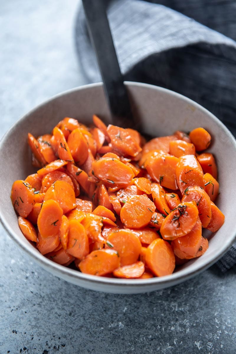 sauteed carrots in bowl with spoon