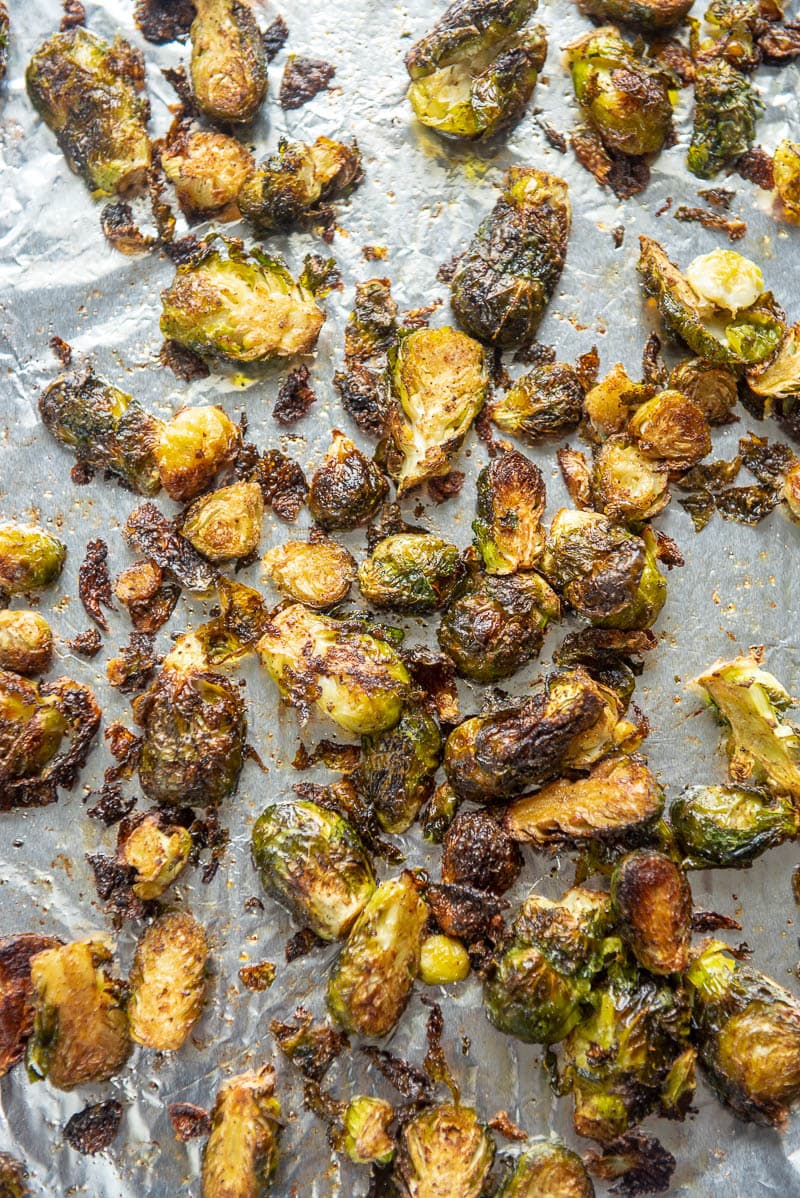 baked spicy brussels sprouts on a baking sheet