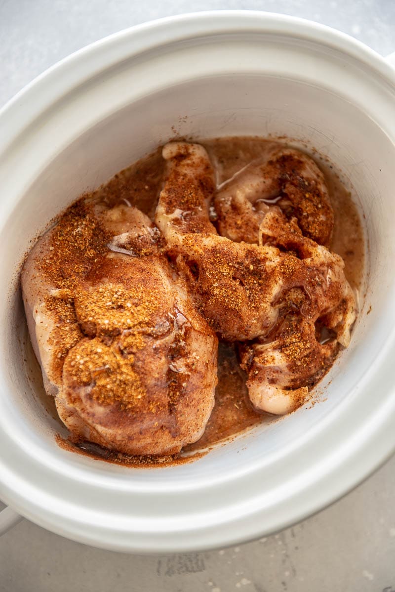 seasoned chicken in a slow cooker