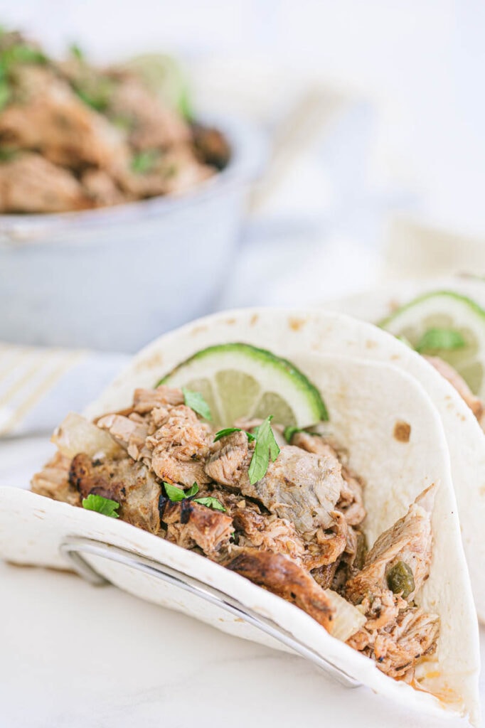 carnitas with lime on a plate