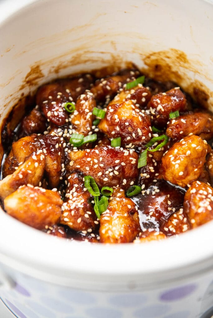 closeup of general tso chicken in a slow cooker