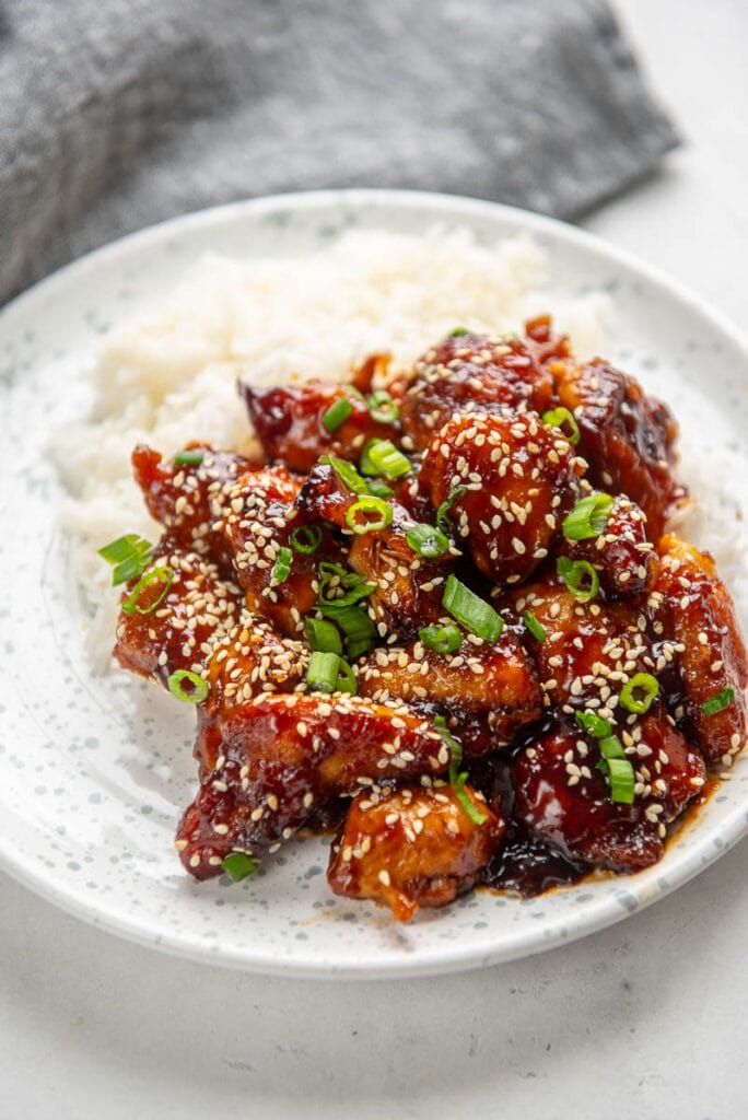 general tso chicken and rice on a plate