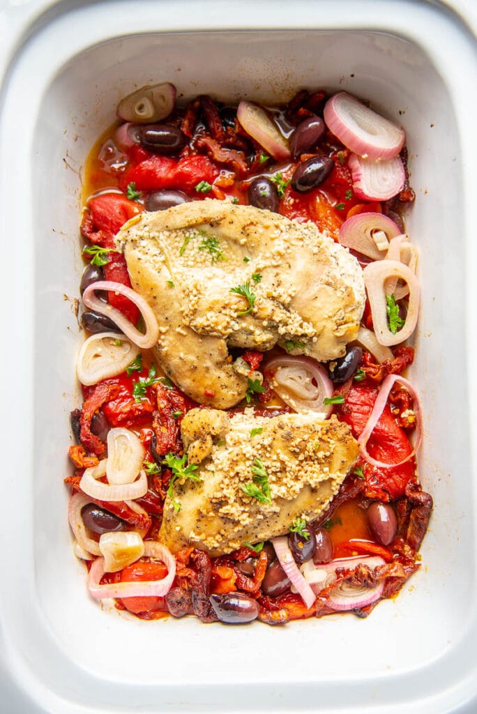 cooked greek chicken in a slow cooker