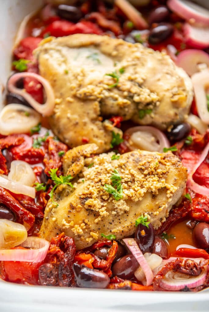 closeup of cooked greek chicken in a slow cooker