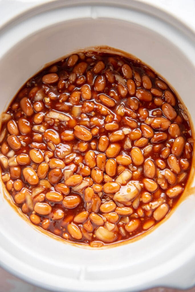 pintos and bbq sauce in a slow cooker