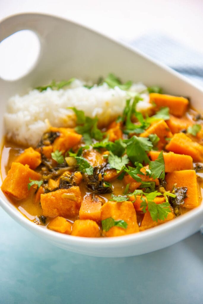 closeup of sweet potato curry in a white bowl