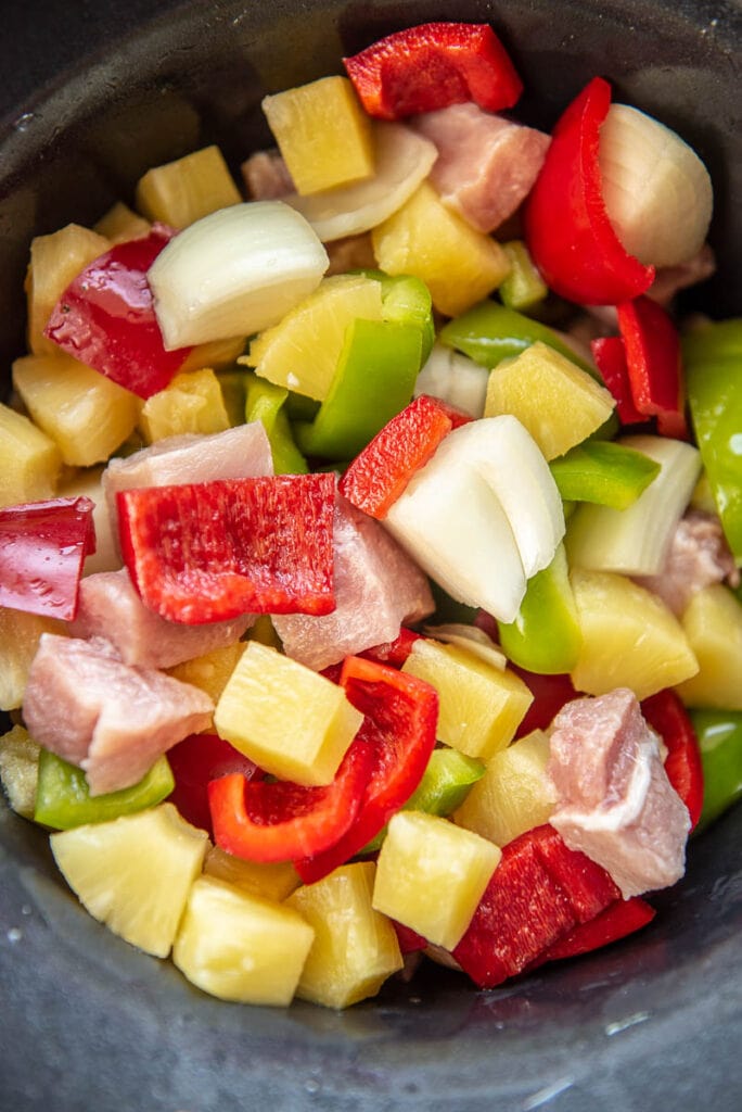 chopped veggies for sweet and sour pork in a slow cooker