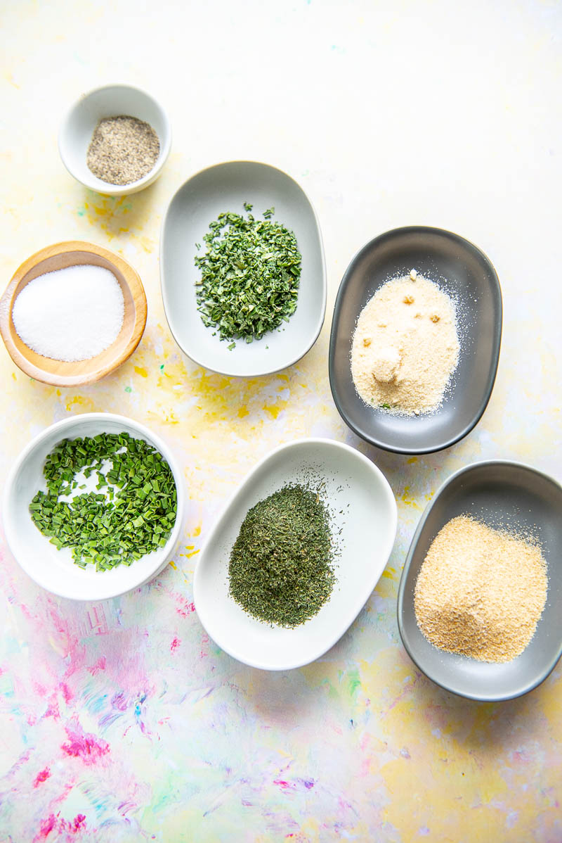 7 small bowls filled with spices