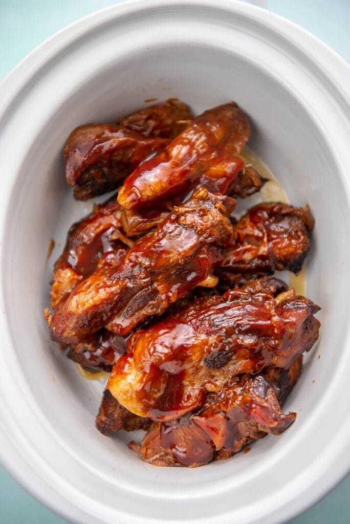 slow cooker filled with boneless bbq ribs