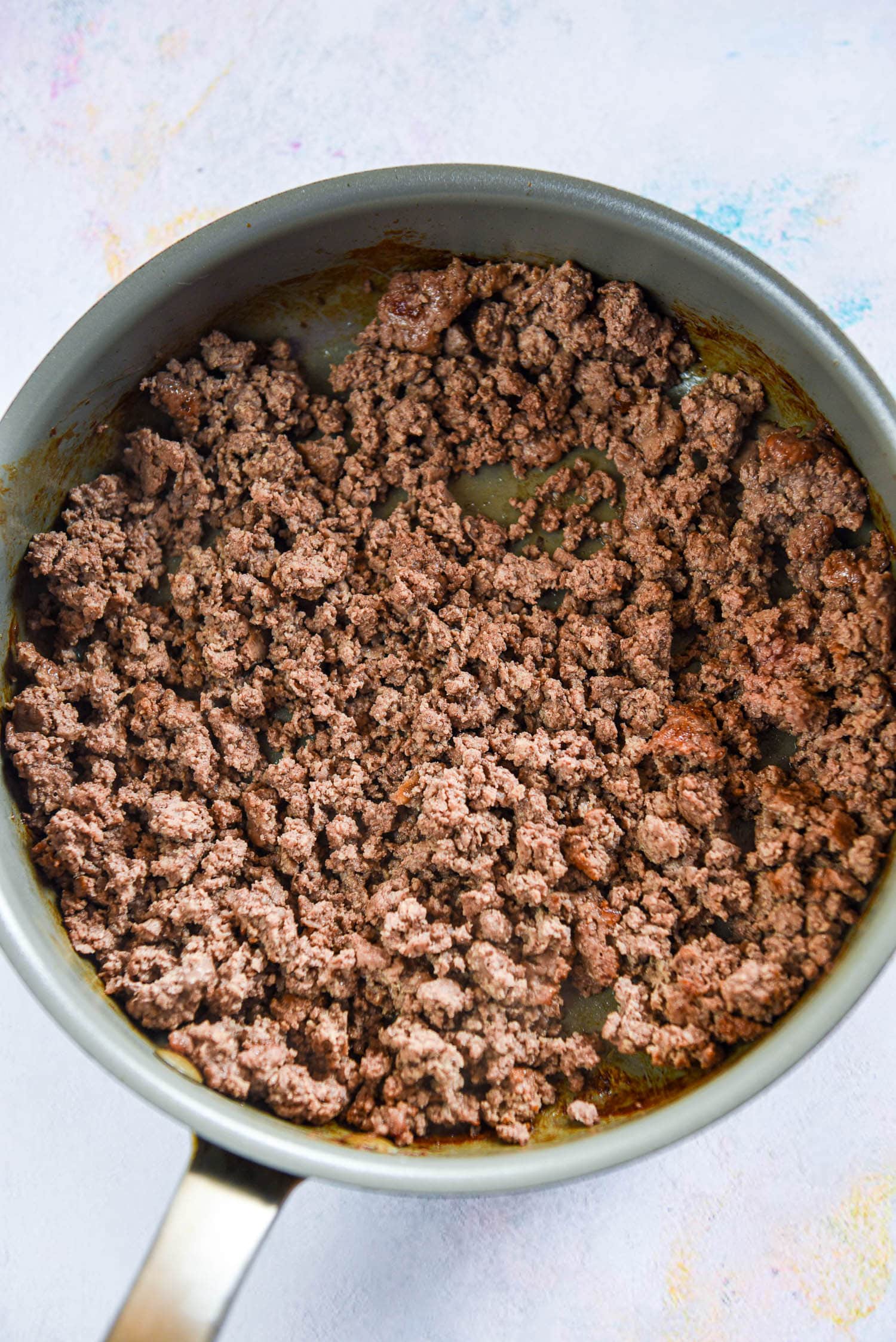 cooked ground beef in skillet