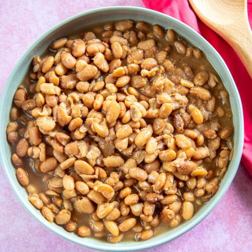 cooked pinto beans in gray serving bowl