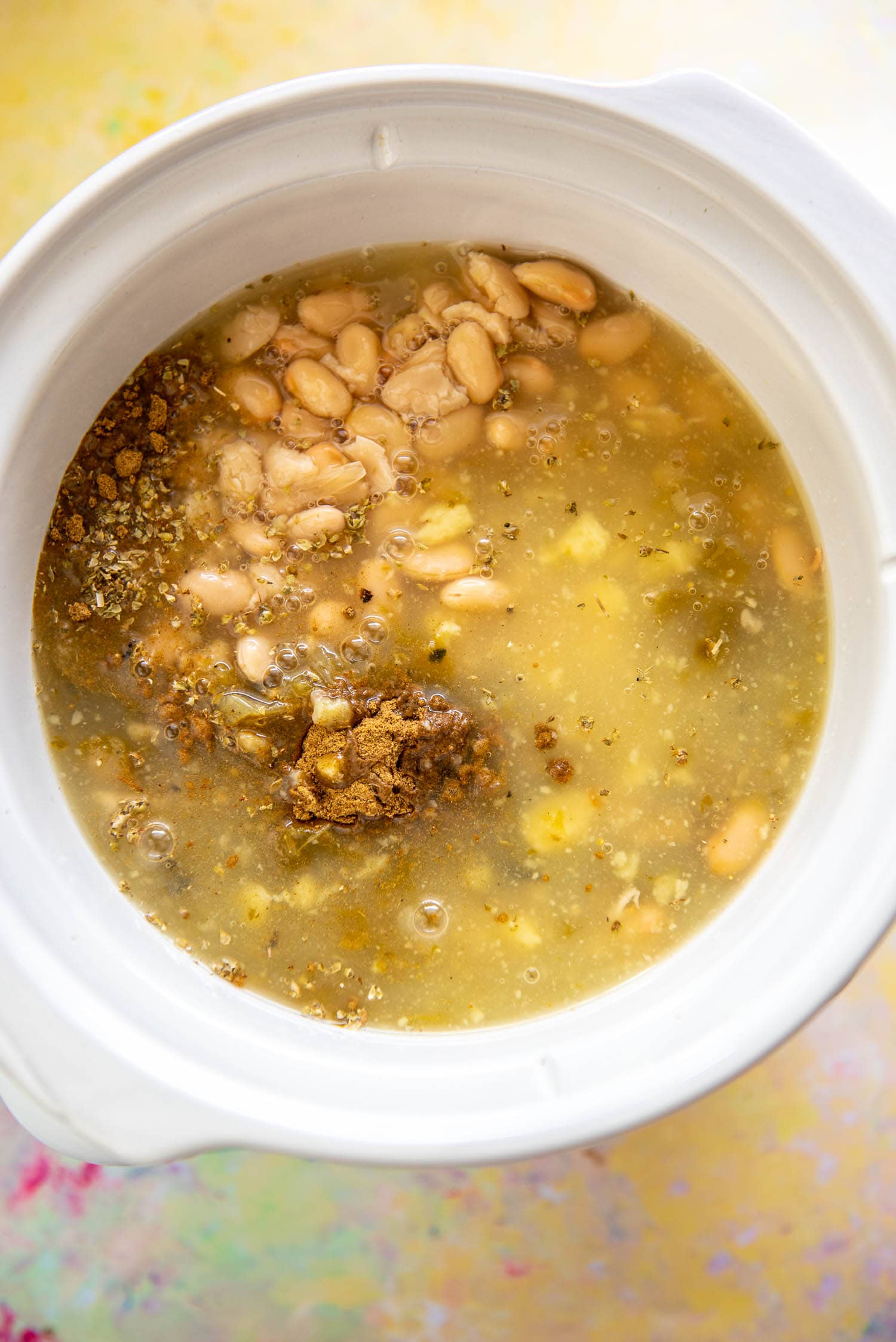 beans, broth and seasoning in slow cooker