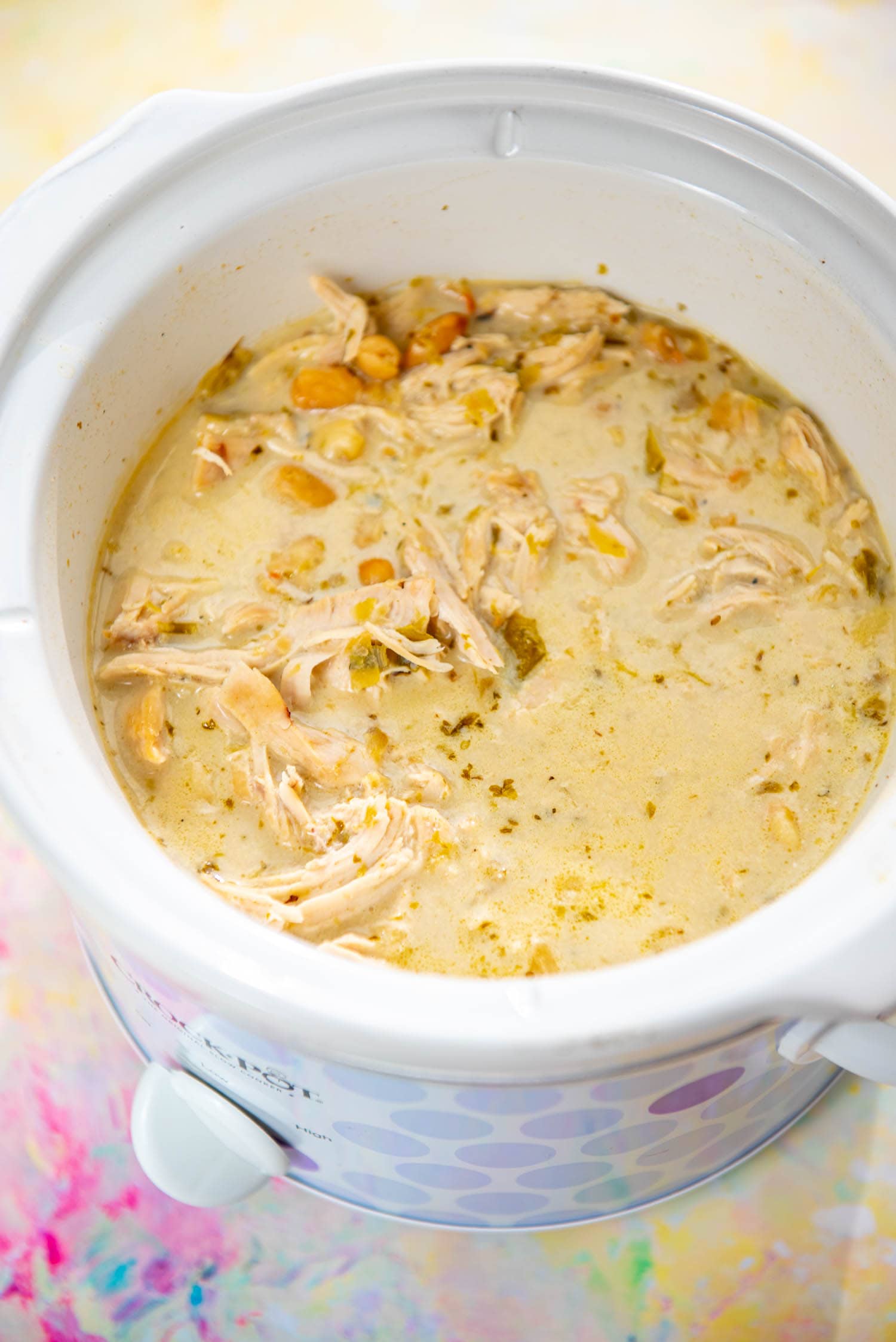 purple polk-a-dot slow cooker filled with white chicken chili