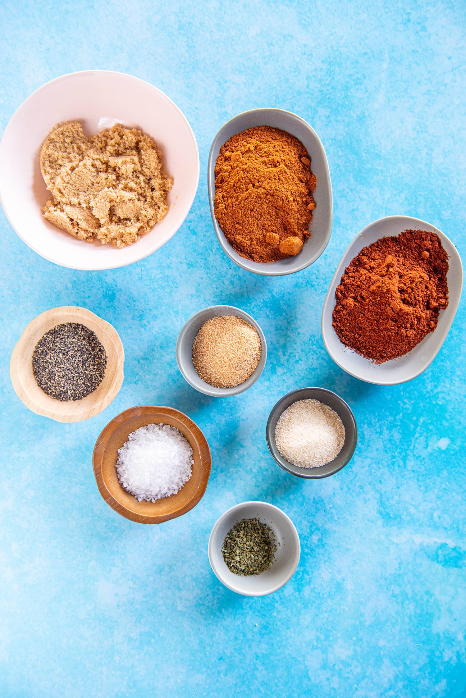 small bowls with individual spices for bbq rub