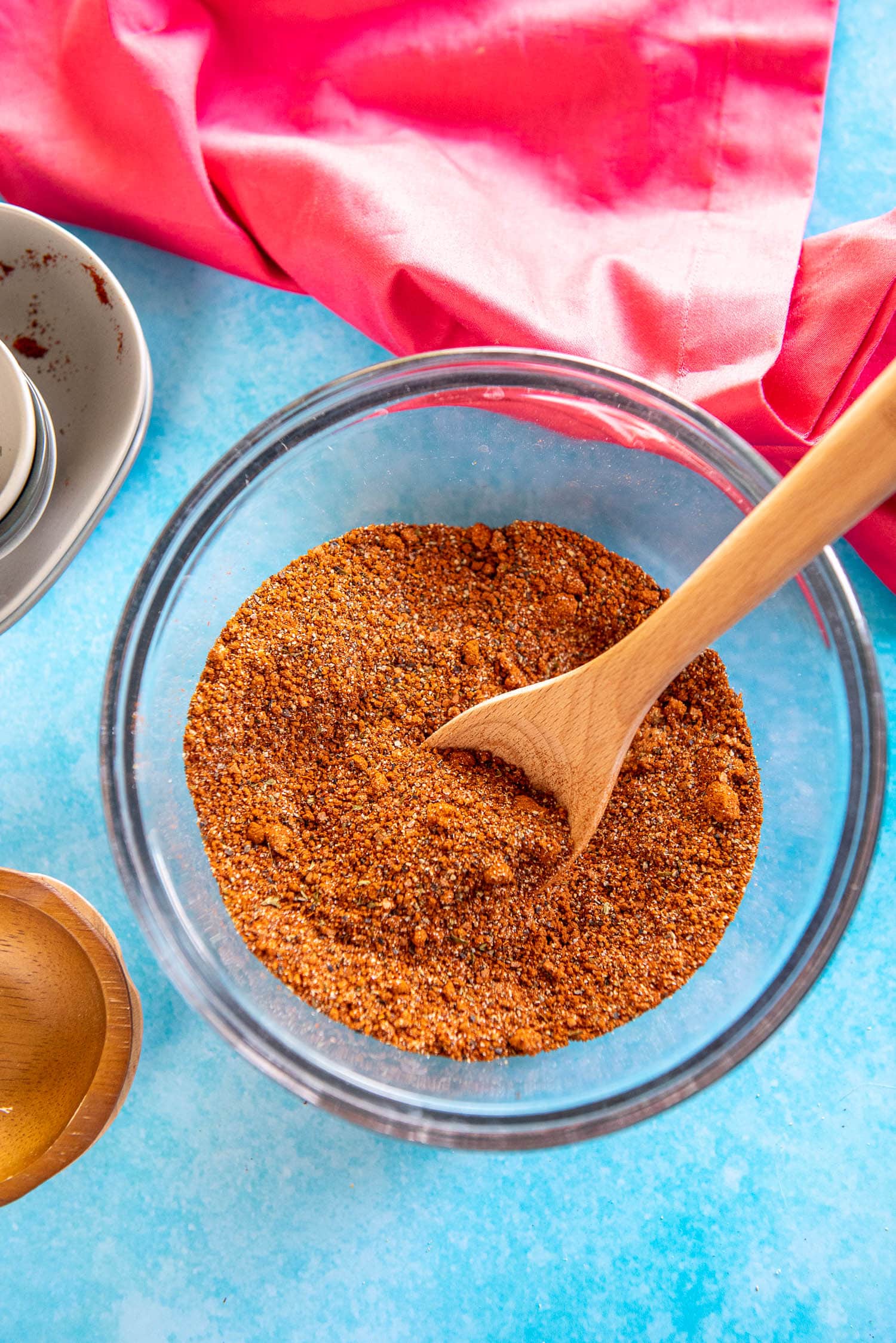 small glass mixing bowl with spices for bbq rub