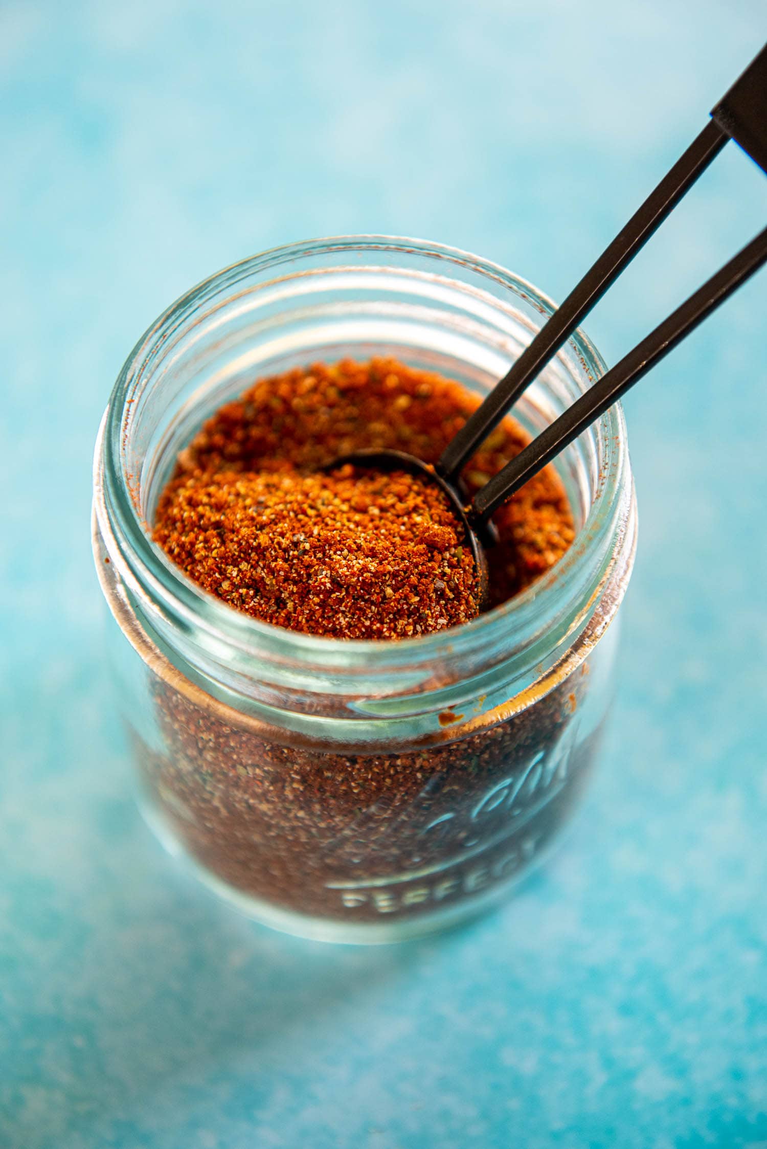 small mason jar filled with homemade bbq rub seasoning