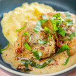 marry me chicken and mashed potatoes garnished on blue plate