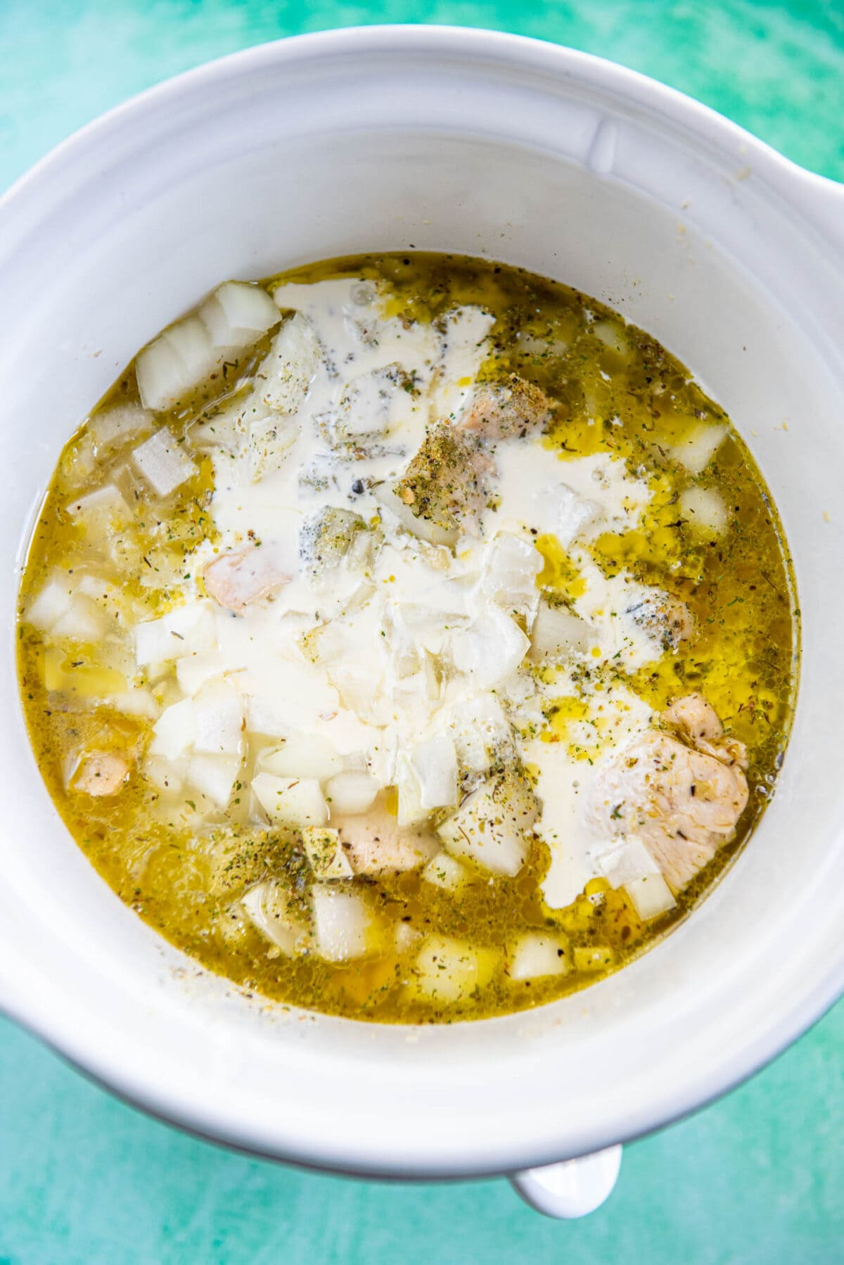 chicken, cream, broth, onions and seasonings in slow cooker