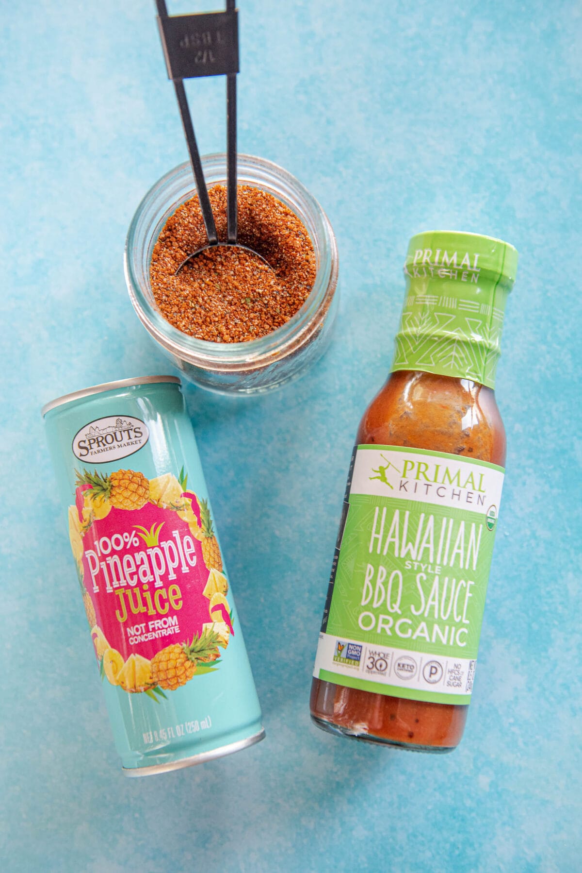 pineapple juice can, seasoning in a jar and bottle of Hawaiian bbq sauce