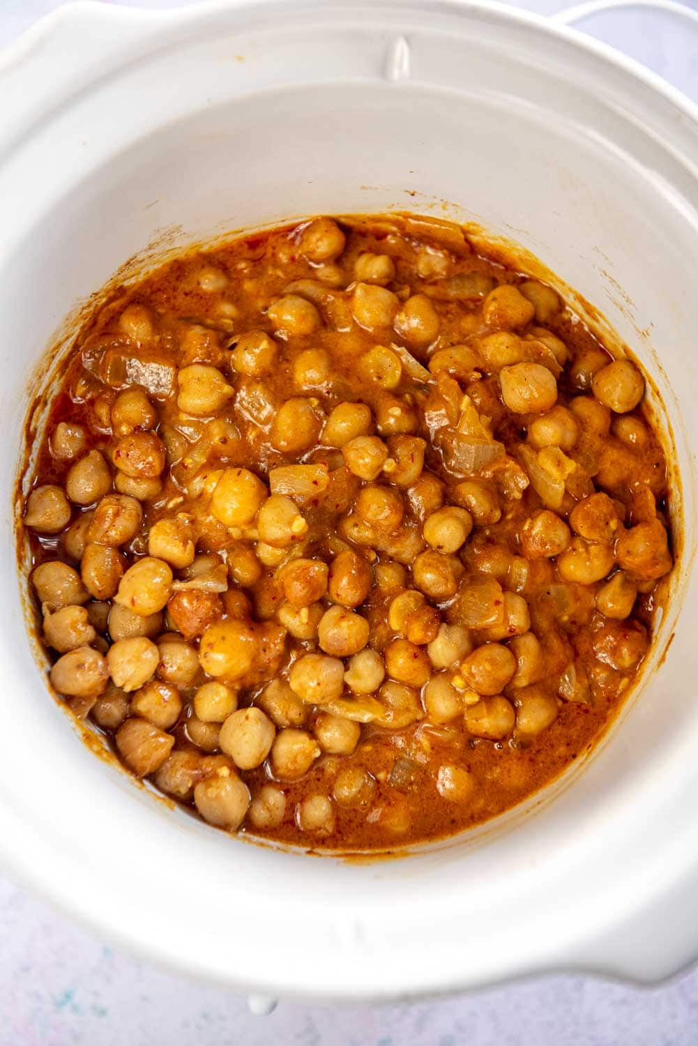 white slow cooker with chickpea curry