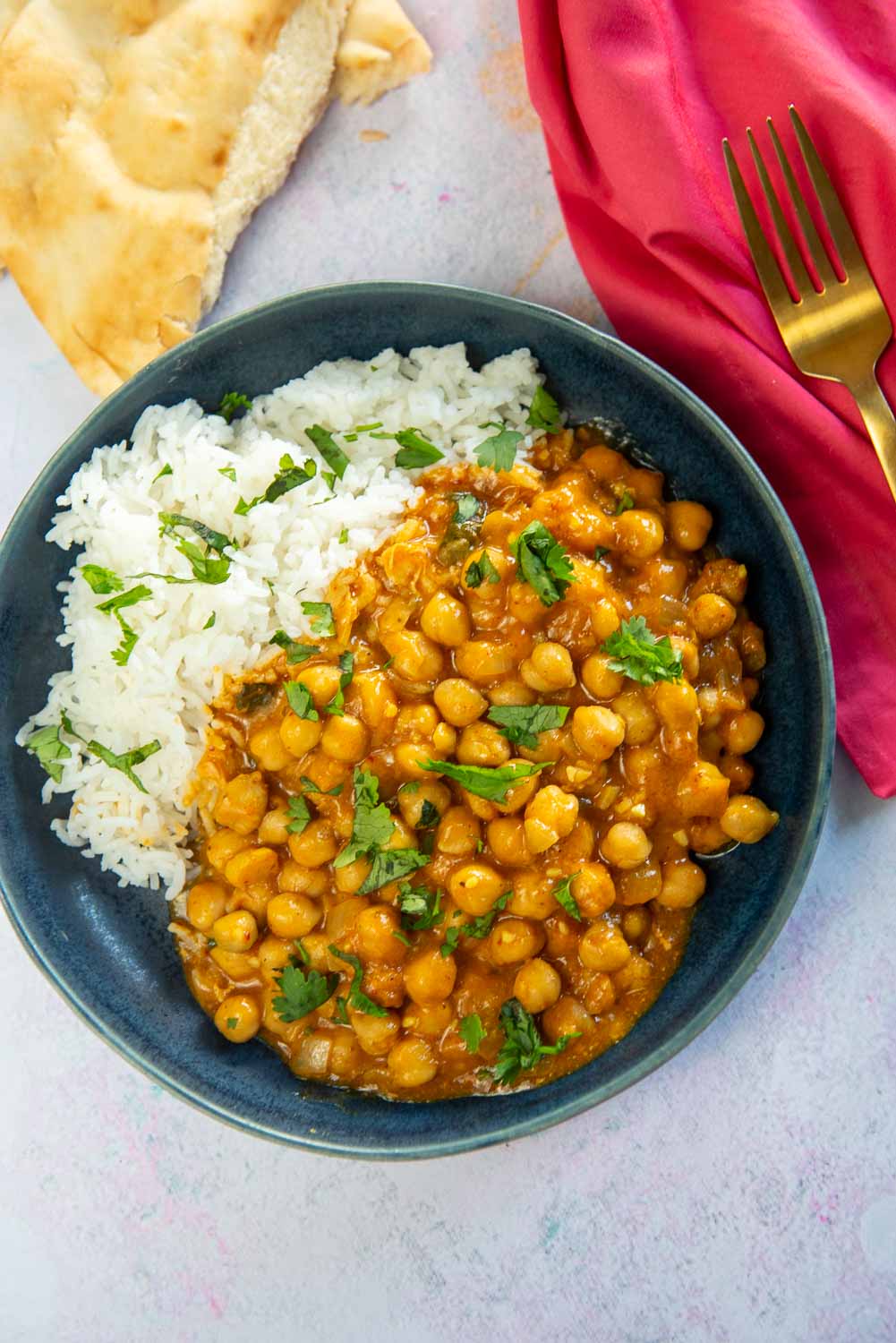 blue plate with chickpea curry and rice