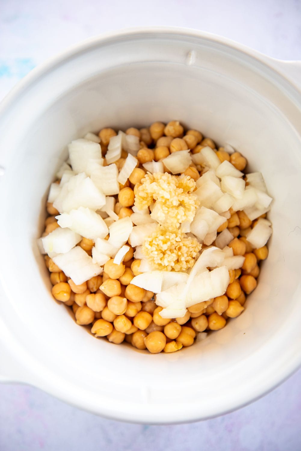 chickpeas, onions and garlic in slow cooker