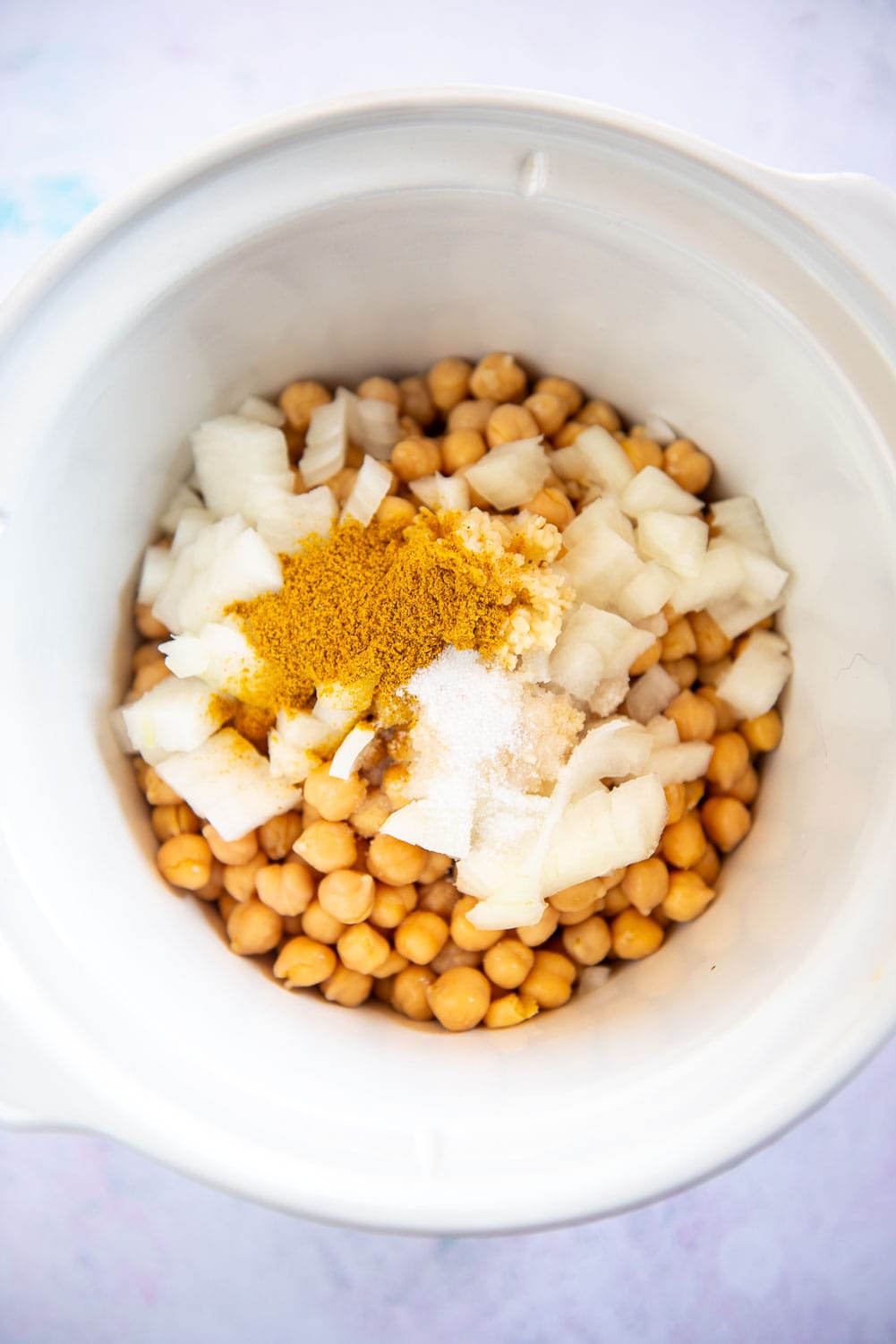 chickpeas, onions and spices in slow cooker