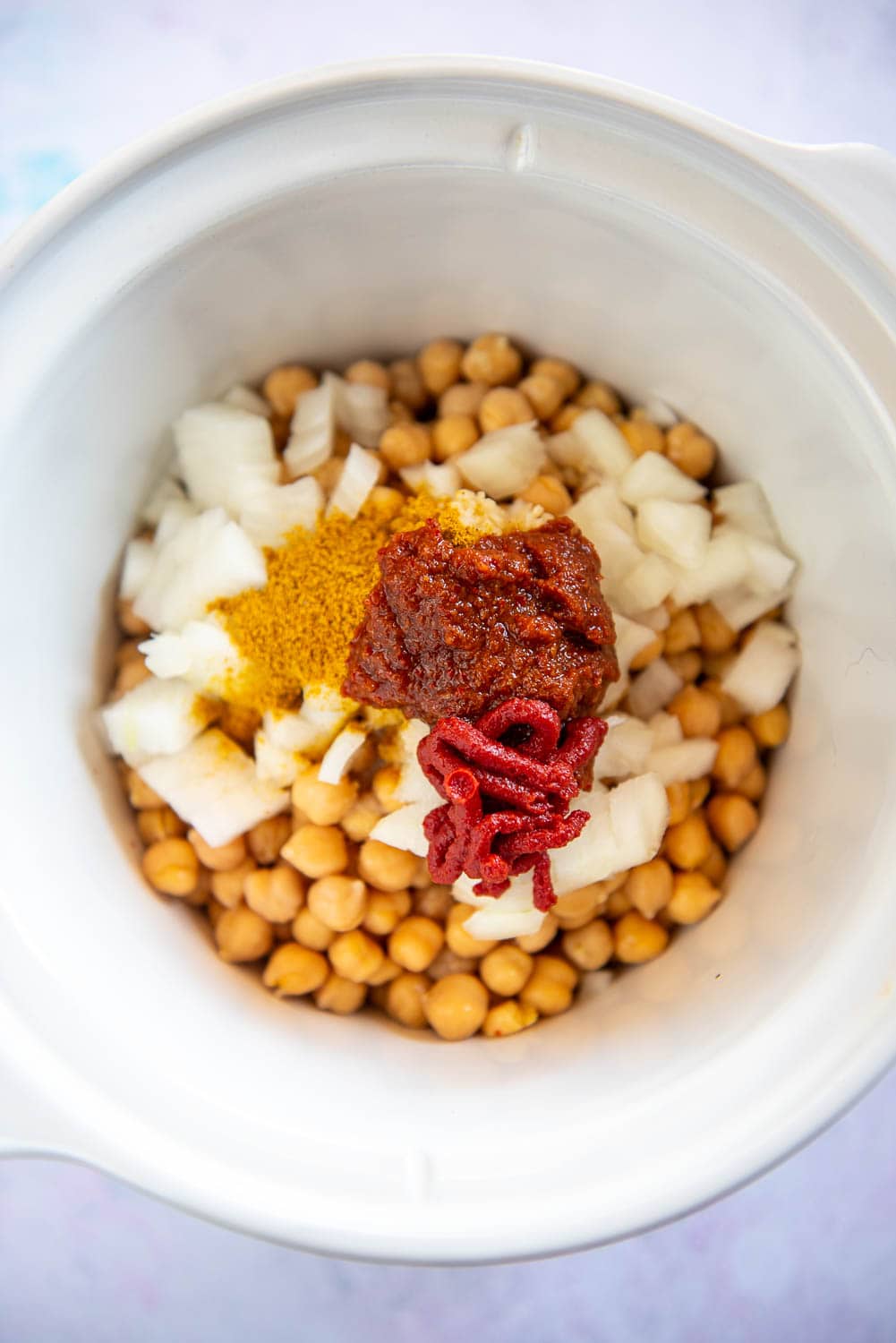 chickpeas, onions, spices and paste in slow cooker