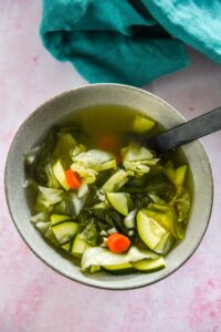 gray bowl filled with miso soup with veggies